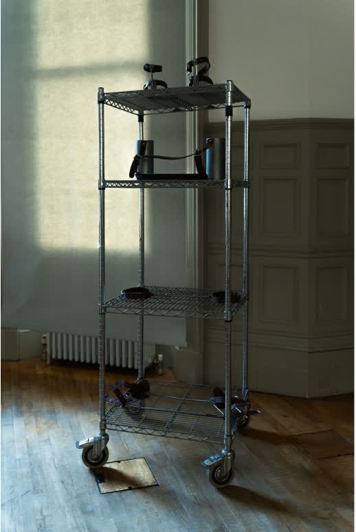 A metal trolley holding the project’s wearable body-alignment devices